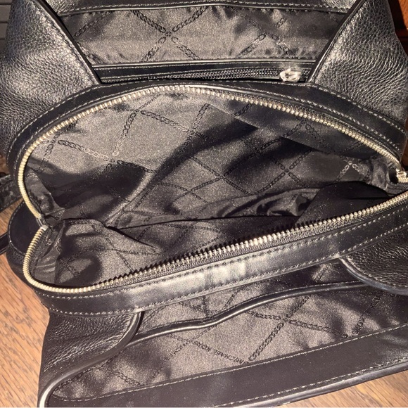 Michael Kors Raven Medium Pebbled Backpack
Black leather with silver hardware - Picture 7 of 13